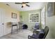 Enclosed Florida room with tiled floors, ceiling fan, and comfortable seating area at 4303 83Rd W St, Bradenton, FL 34209