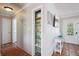 Hallway with tile flooring, interior storage, and view of exterior front door at 4303 83Rd W St, Bradenton, FL 34209