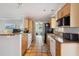 Bright kitchen featuring tile floors, granite counters, stainless appliances and breakfast bar seating at 4303 83Rd W St, Bradenton, FL 34209