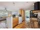 Open kitchen featuring granite countertops, stainless steel appliances, tile flooring and ample cabinetry at 4303 83Rd W St, Bradenton, FL 34209