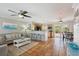 Open-concept living room and kitchen with tile floors and comfortable seating at 4303 83Rd W St, Bradenton, FL 34209