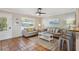 Bright living room featuring tile flooring, comfortable seating, and ample natural light at 4303 83Rd W St, Bradenton, FL 34209