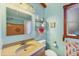 Cozy bathroom featuring a sink, toilet, shower, and nautical decor at 4528 58Th W St, Bradenton, FL 34210