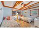Comfortable bedroom with two twin beds, wood-beam ceiling, and coastal themed decor at 4528 58Th W St, Bradenton, FL 34210