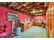 Interior with wooden beams, pink walls, green floors, window, storage and ceiling fan at 4528 58Th W St, Bradenton, FL 34210