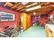 Interior storage room featuring wood beams, ceiling fan, and lots of storage space at 4528 58Th W St, Bradenton, FL 34210