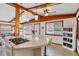 Bright kitchen with a cooking island, wood beams, and natural light at 4528 58Th W St, Bradenton, FL 34210