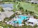 Aerial view of community pool, golf course, and surrounding landscaping at 4720 Arpino Ct, Bradenton, FL 34211