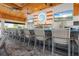 Clubhouse bar with elegant seating, multiple TVs, and a variety of beverage options at 4720 Arpino Ct, Bradenton, FL 34211