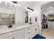 Bright bathroom with double sinks, walk-in closet access and a glass-enclosed shower at 4720 Arpino Ct, Bradenton, FL 34211
