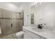 Contemporary bathroom showcasing granite counters, a glass shower, and neutral-toned tiles at 4720 Arpino Ct, Bradenton, FL 34211