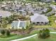 Aerial view of bocce ball courts with clubhouse and parking in the community at 4720 Arpino Ct, Bradenton, FL 34211