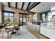 Bright cafe with modern decor, patterned tile floor, and comfortable seating with large windows at 4720 Arpino Ct, Bradenton, FL 34211
