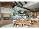 Inviting cafe with dark wooden tables and tiled flooring, showcasing an open and airy space at 4720 Arpino Ct, Bradenton, FL 34211