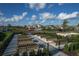 Community garden with raised garden beds and paved walkways surrounded by newly constructed homes at 4720 Arpino Ct, Bradenton, FL 34211