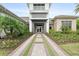 Beautiful home exterior featuring a professionally landscaped walkway and modern architectural design at 4720 Arpino Ct, Bradenton, FL 34211