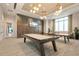 Community game room with pool table, ping pong table, and modern lighting at 4720 Arpino Ct, Bradenton, FL 34211