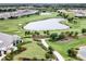 Scenic aerial view of the golf course and lakes within the residential community at 4720 Arpino Ct, Bradenton, FL 34211