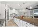 Spacious kitchen boasts an expansive island with granite countertops, pendant lighting, and an open layout at 4720 Arpino Ct, Bradenton, FL 34211