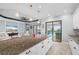 Spacious kitchen island offering seating with views of the living area, plus access to the outdoor pool at 4720 Arpino Ct, Bradenton, FL 34211
