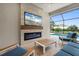 Beautiful lanai with a fireplace, TV, comfortable seating and views of the pool at 4720 Arpino Ct, Bradenton, FL 34211