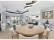 Open concept living area with lots of light, including an open-concept kitchen with bar seating at 4720 Arpino Ct, Bradenton, FL 34211
