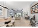 Open-concept living area with dining and kitchen views, plus access to a pool via sliding glass doors at 4720 Arpino Ct, Bradenton, FL 34211