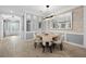 Elegant living room features modern lighting, and neutral décor and provides a welcoming space for relaxation and entertaining at 4720 Arpino Ct, Bradenton, FL 34211