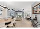 Open-concept living area with dining and kitchen views, plus access to a pool via sliding glass doors at 4720 Arpino Ct, Bradenton, FL 34211