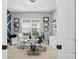 Bright office with a modern desk, a stylish light fixture, and wall decorations creating a productive atmosphere at 4720 Arpino Ct, Bradenton, FL 34211