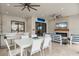 Chic outdoor living area with a dining table, bar, and seating, perfect for entertaining or relaxing by the pool at 4720 Arpino Ct, Bradenton, FL 34211
