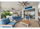 Spacious outdoor living area featuring comfortable seating, an outdoor kitchen, and a stunning pool view at 4720 Arpino Ct, Bradenton, FL 34211