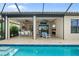 Stunning view from the pool showcasing the expansive patio and seamless transition to the indoor living area at 4720 Arpino Ct, Bradenton, FL 34211