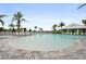 Beautiful community pool with zero entry, lounge chairs, and nearby bar at 4720 Arpino Ct, Bradenton, FL 34211