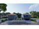 Back view of charming two-story homes with garages and well-kept lawns at 4755 11Th S Ave, St Petersburg, FL 33711
