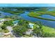 Aerial view of community amenities including pool, tennis courts, and access to the water at 4811 14Th E Ave, Bradenton, FL 34208