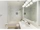 Bright bathroom featuring marble-look shower tile, updated lighting, and a modern vanity at 4811 14Th E Ave, Bradenton, FL 34208