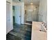 Modern bathroom featuring a marble-look walk-in shower and stylish fixtures at 4811 14Th E Ave, Bradenton, FL 34208