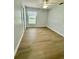 Bedroom with a ceiling fan, and wood-look flooring at 4811 14Th E Ave, Bradenton, FL 34208