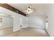 Neutral bedroom features a ceiling fan, patterned accent wall and mirror door closet at 4811 14Th E Ave, Bradenton, FL 34208