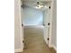 Bright bedroom featuring light walls and wood floors with a ceiling fan for added comfort at 4811 14Th E Ave, Bradenton, FL 34208