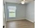 Bedroom with a ceiling fan, and wood-look flooring at 4811 14Th E Ave, Bradenton, FL 34208