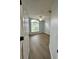 Bedroom with a ceiling fan, and wood-look flooring at 4811 14Th E Ave, Bradenton, FL 34208