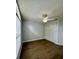Bedroom with a ceiling fan, and wood-look flooring at 4811 14Th E Ave, Bradenton, FL 34208
