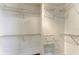 Spacious walk-in closet with extensive shelving units and organization systems at 4811 14Th E Ave, Bradenton, FL 34208