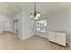 Dining area with wood-look floors and natural light, with access to the kitchen and sliding glass doors at 4811 14Th E Ave, Bradenton, FL 34208