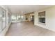 Enclosed Florida room with glass windows and doors, durable flooring and a ceiling fan at 4811 14Th E Ave, Bradenton, FL 34208