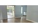 View of the open living room with sliding glass doors to lanai and view of kitchen at 4811 14Th E Ave, Bradenton, FL 34208