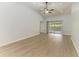 Expansive living area with neutral walls, recessed lighting, ceiling fan, and a sliding door to the lanai at 4811 14Th E Ave, Bradenton, FL 34208