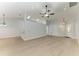 Spacious living room with light floors, neutral walls, a ceiling fan, and natural light at 4811 14Th E Ave, Bradenton, FL 34208